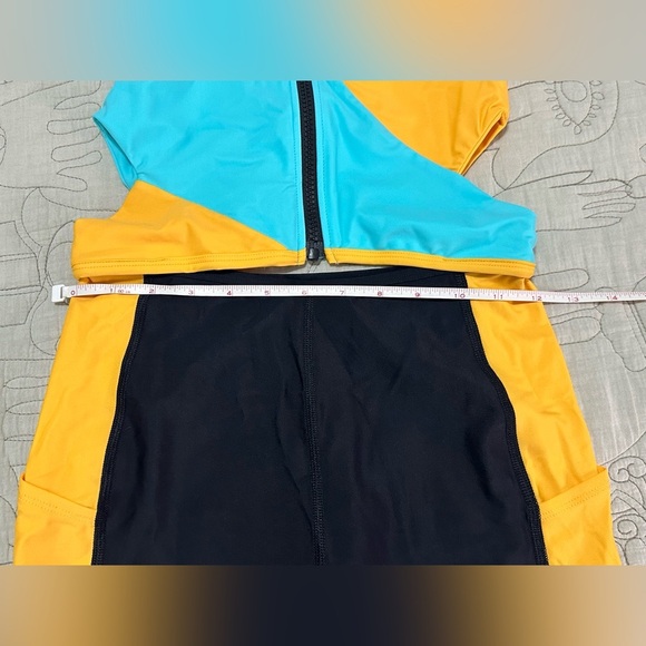 NWT Outdoor Voices SplashKnit 6" Bodysuit XS Colorblock Black, Teal, and Yellow - Picture 11 of 12